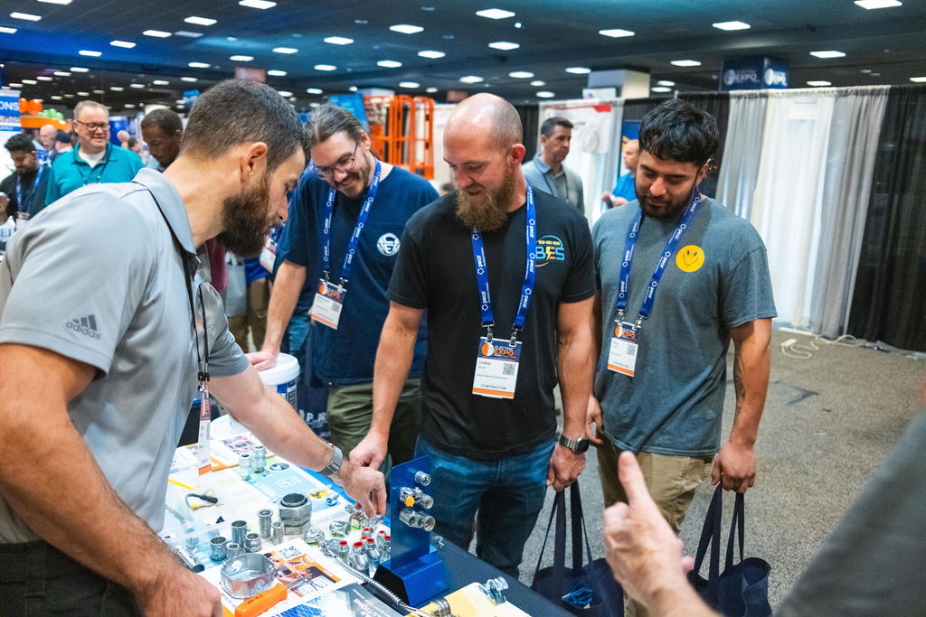 expo attendees at table Exhibitor Resource Center